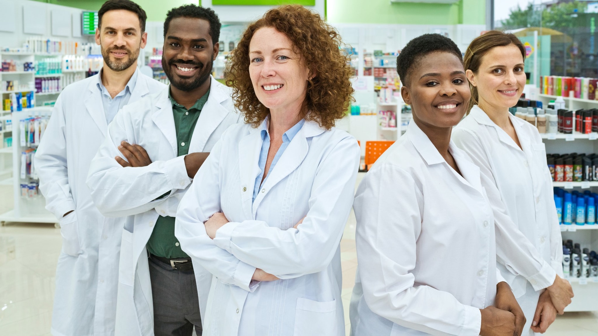 Group of pharmacists standing in a pharmacy