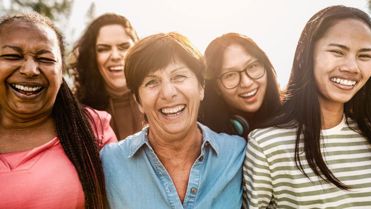 Group of diverse women smiling outdoors