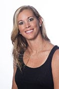 Headshot of Karma Harris. She has blond hair and a black tank top in front of a white background.