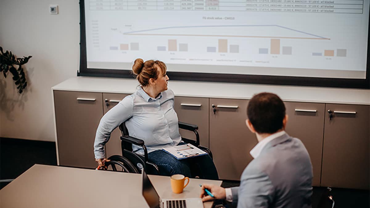 Two colleagues presenting data