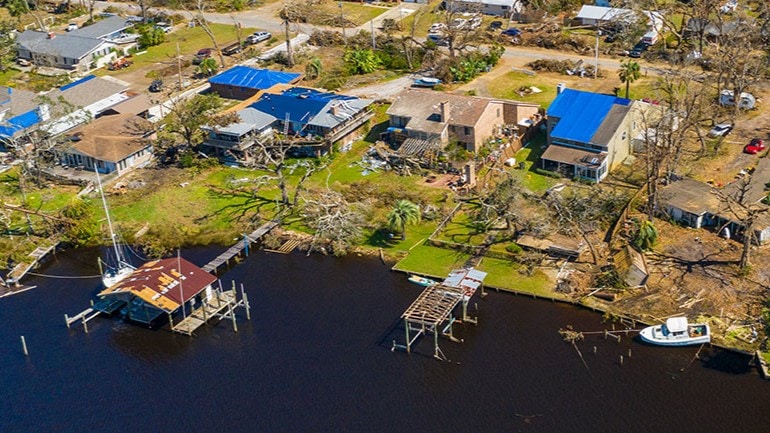 Aerial view of a neighborhood damaged by a natural disaster.