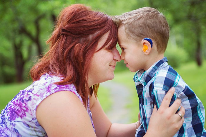 Mother and son looking at each other.