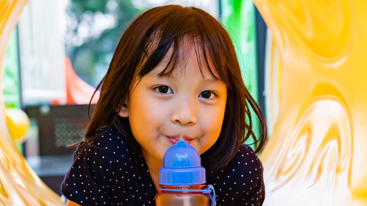 Girl with sippy cup