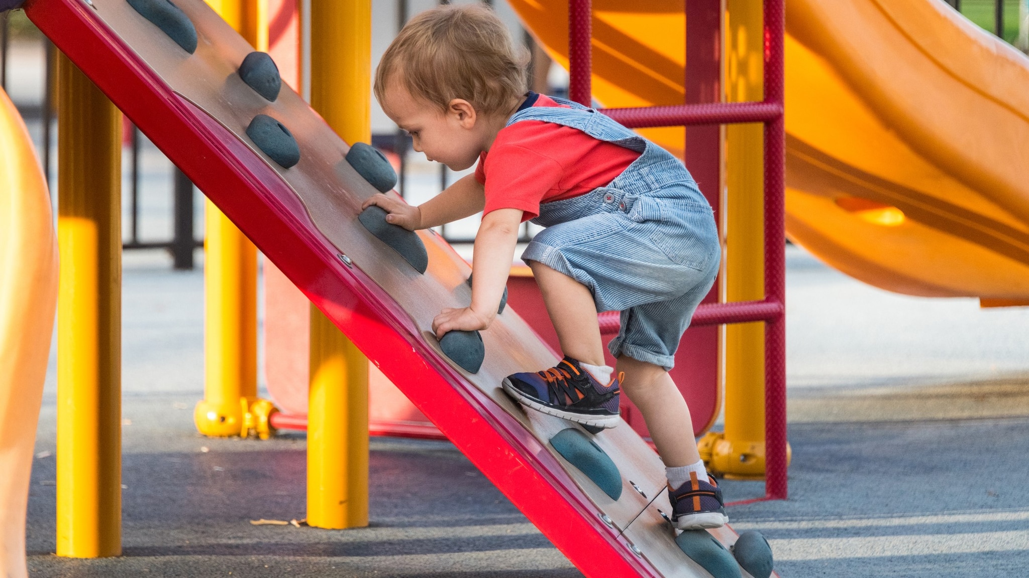 Young boy climbing in playground