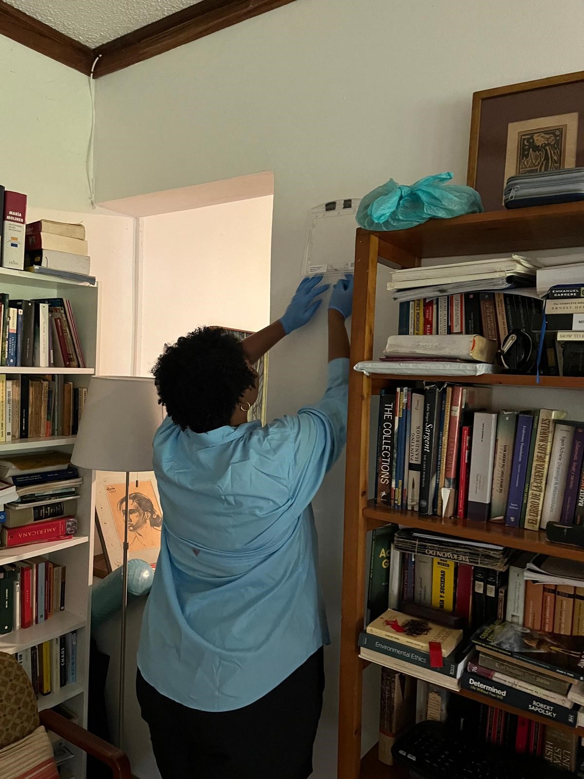 EIS Officer Fhallon Ware-Gilmore (Class of 2023) installing Passive Emanators in the homes of interested residents during the dengue outbreak in Puerto Rico. These devices, also known as spatial repellents, slowly release an insecticide, such as transfluthrin, into the air without using heat or electricity. By creating a protective barrier, they help reduce mosquito bites and limit dengue virus transmission.