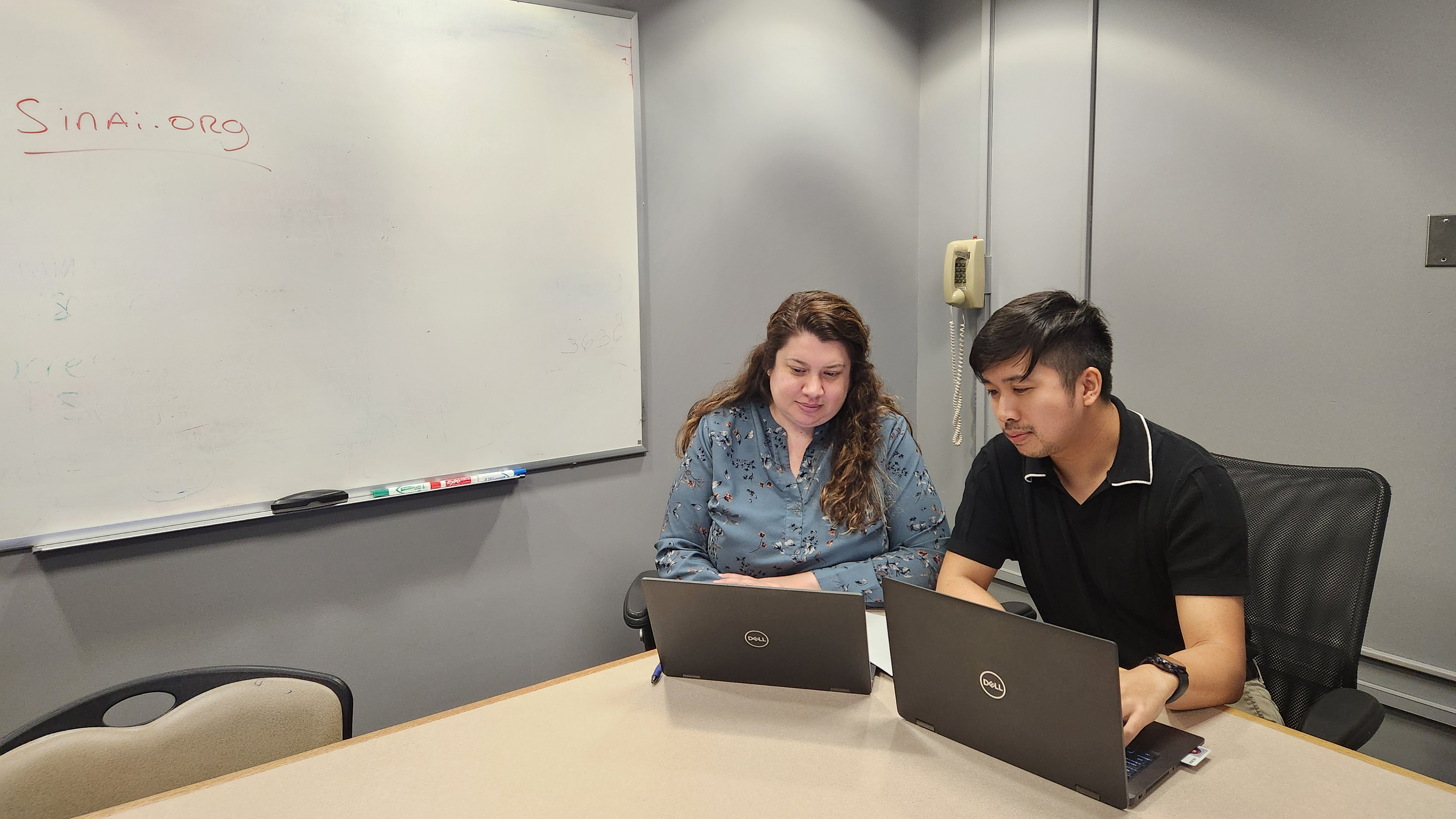 EIS Class of 2023 officers Kimberly Gressick (left) and John Le (right) abstract information from hospital records to characterize an overdose outbreak.
