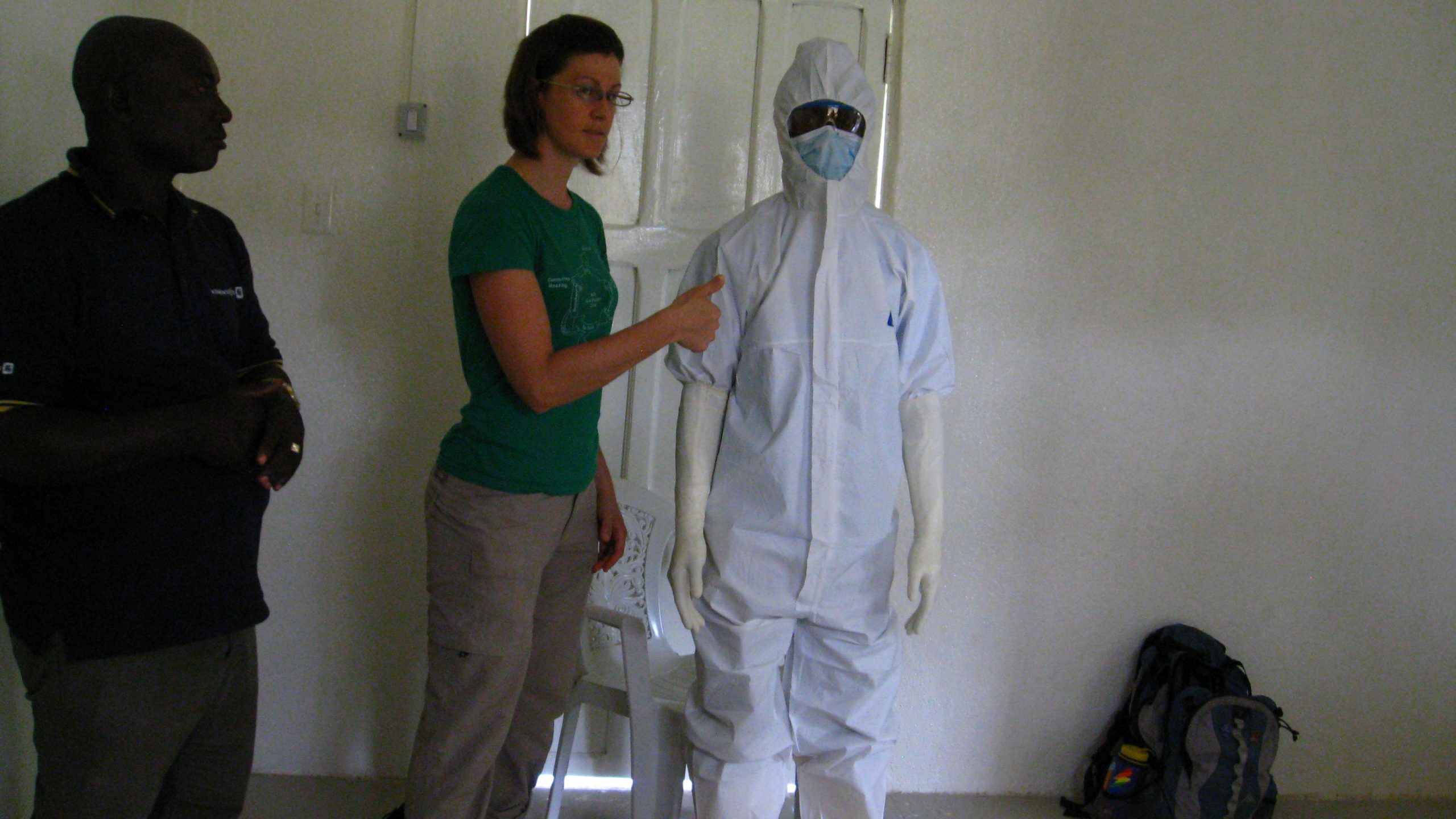 Karlyn Beer, MS, PhD (EIS Class of 2023) (center) and members of Liberia’s Grand Kru County ambulance and burial team, after a PPE donning/doffing training.