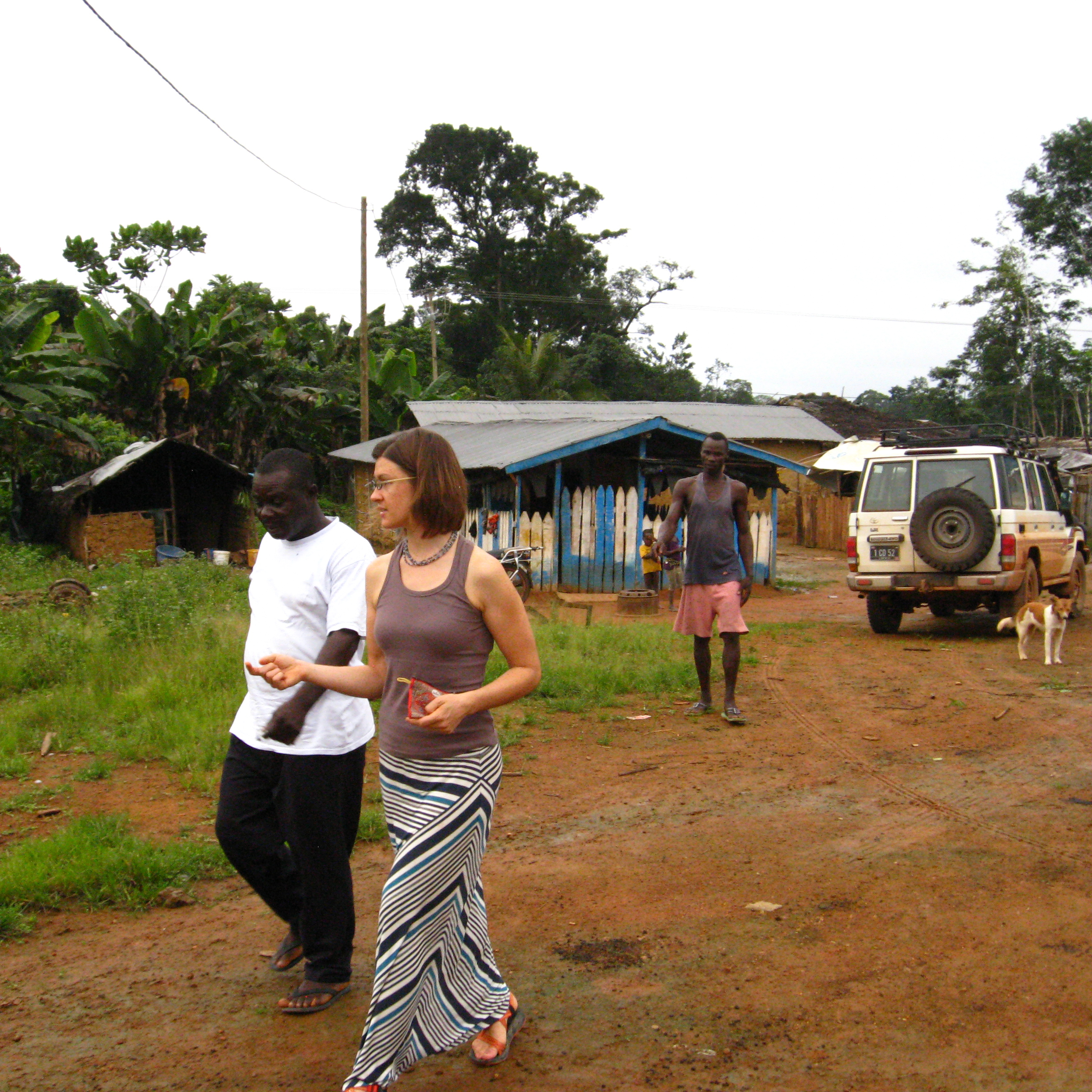 Karlyn Beer, MS, PhD (EIS Class of 2023) and Liberia county health team colleagues discussing local clinic capacity and preparedness plans near the border with Cote d'Ivoire.