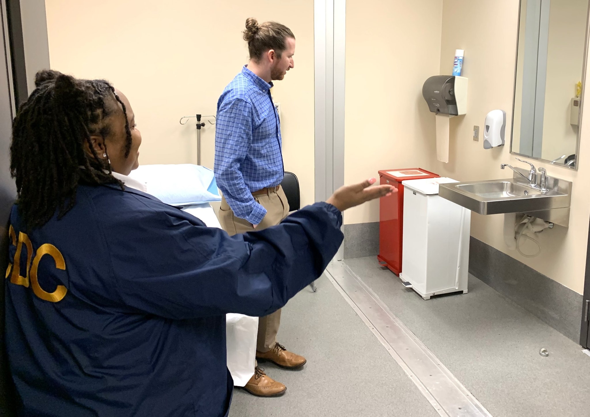 2024 EEP student, Grayson Walker (right), visits the CDC Port Health Station in Atlanta, Georgia to meet with Port Health Protection Officer Shacore Crumel and tour the sick passenger isolation facilities.