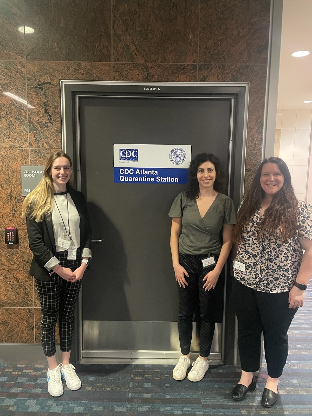 2024 EEP students Chloe, Lily, and Kaitlyn visit the Atlanta airport's port health station and get to view one of the quarantine rooms that would be used for an individual who may have an infectious disease that threatens public health.