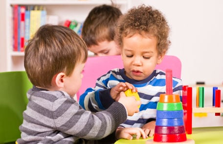 Two children playing with toys