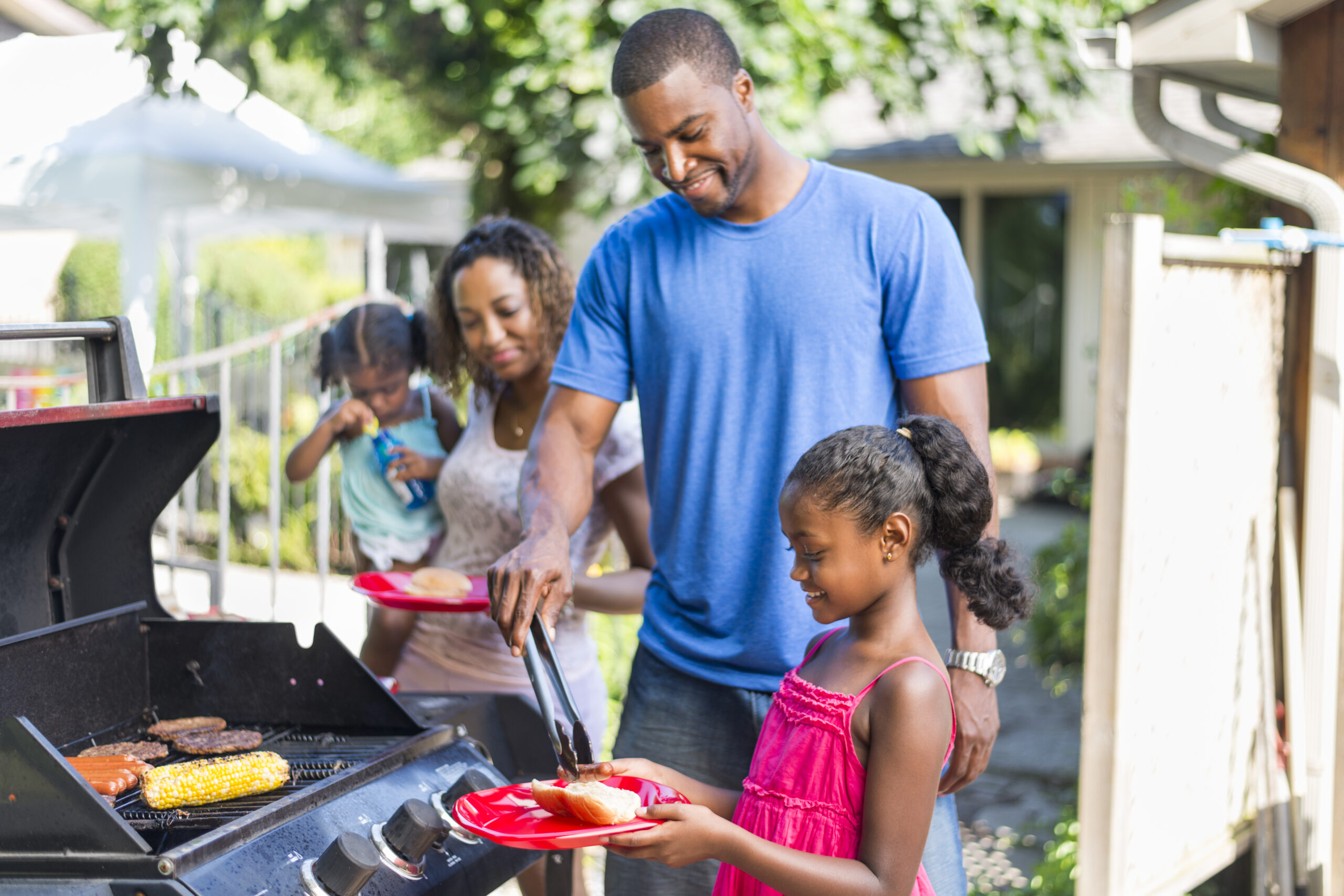Family grilling outdoors