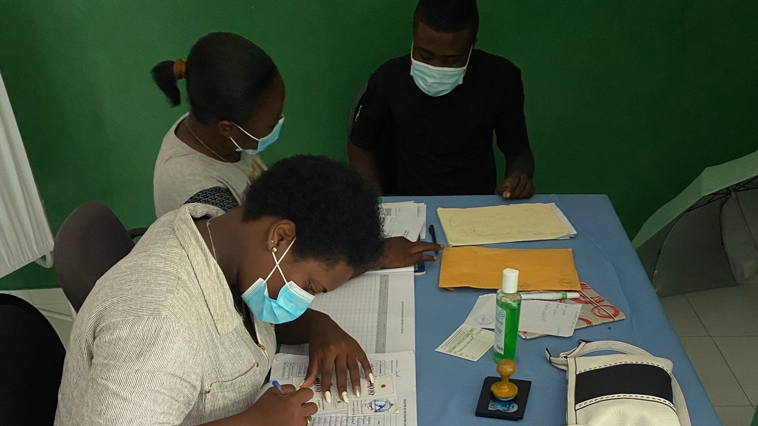 womens filling out forms at covid 19 testing site