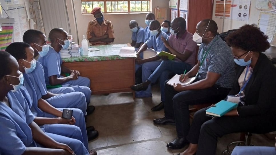 Dr. Richard Migisha and Job Morukileng, and supervisor Claire Biribawa, conduct interviews with healthcare workers