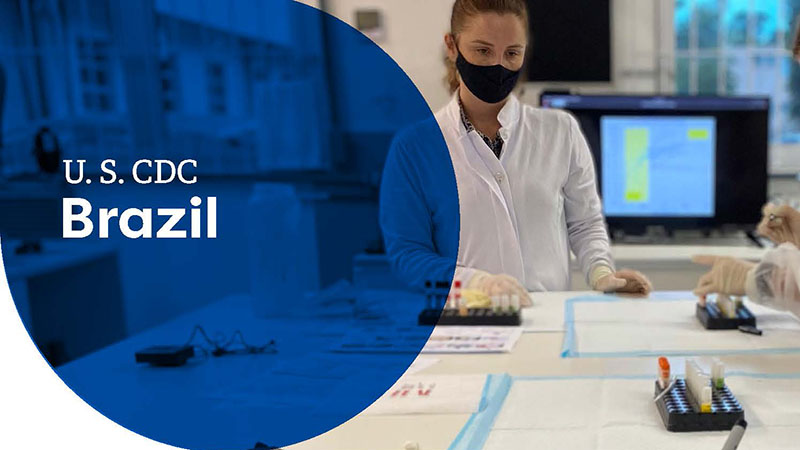 U.S. CDC Brazil graphic with a masked scientist working in a lab.