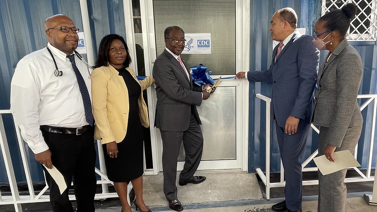 In 2022, Ambassador Nick N. Perry & then CDC Caribbean Office Director Dr. Emily Kainne Dokubo donated three retrofitted 20-foot containers to the Ministry of Health & Wellness (MOHW) – Jamaica.