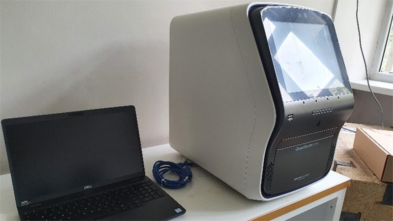 Photo of a laptop and laboratory equipment.
