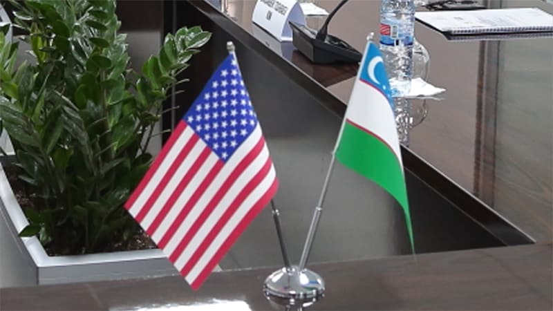 United States of America flag and Uzbekistan flag
