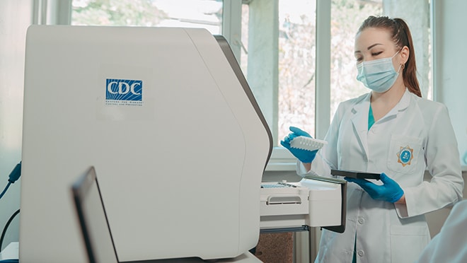 CDC microbiologist works in a lab in Kazakhstan.