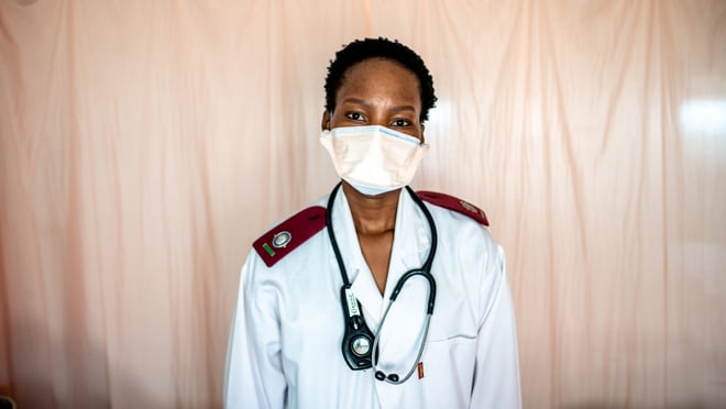 Health worker wearing a mask in a clinic.