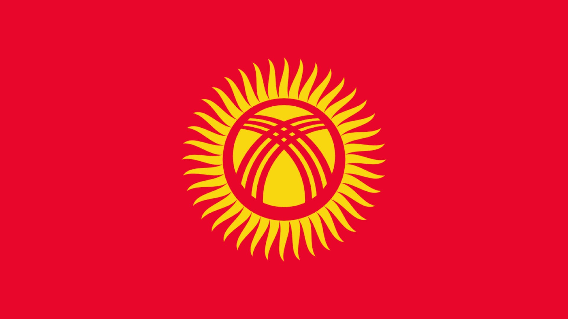 Kyrgyzstan flag is red  with a gold sun in the center.
