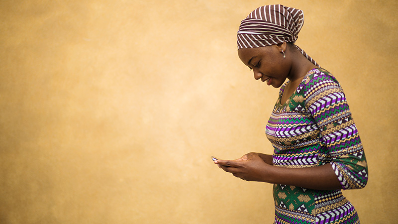 Woman texting on a mobile device.