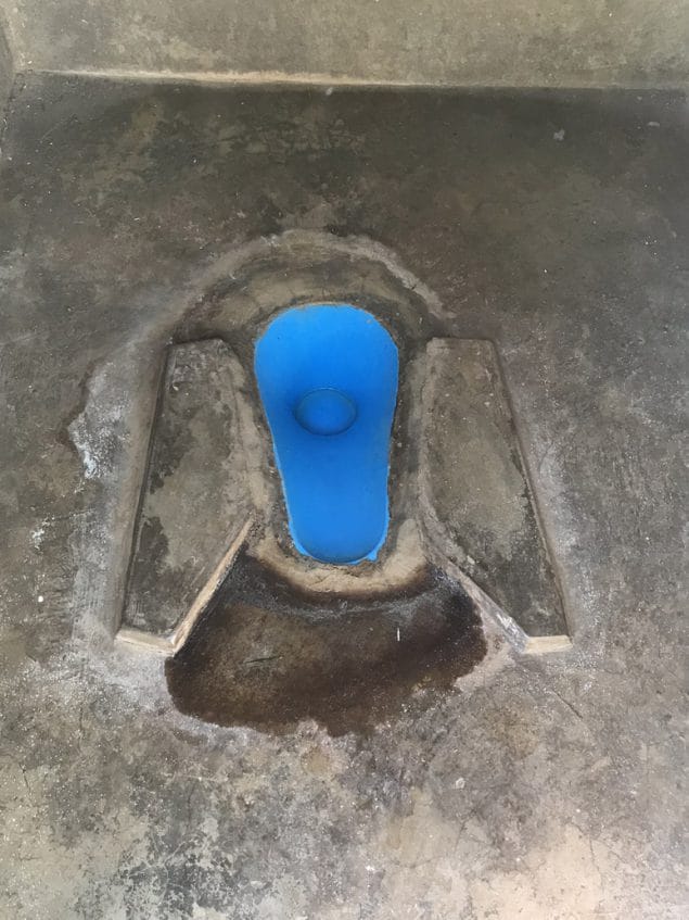 Plastic insert built into a latrine drophole. Photo credit: David Berendes
