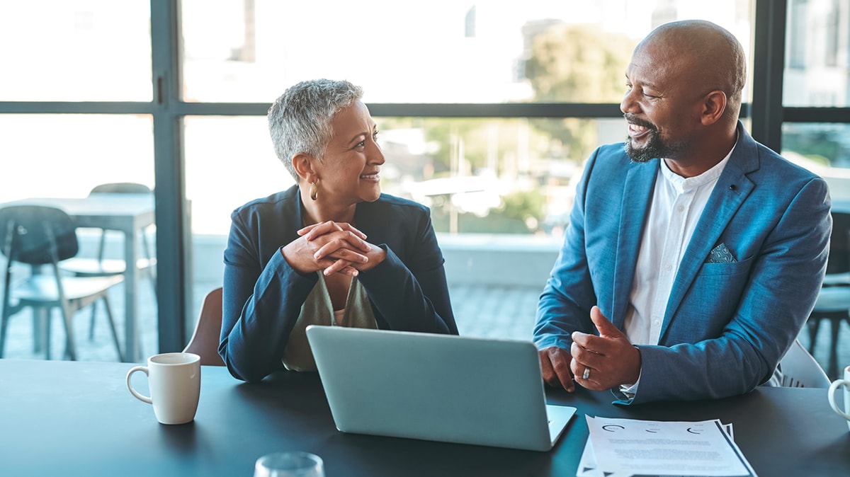 Image of two professionals in an office setting