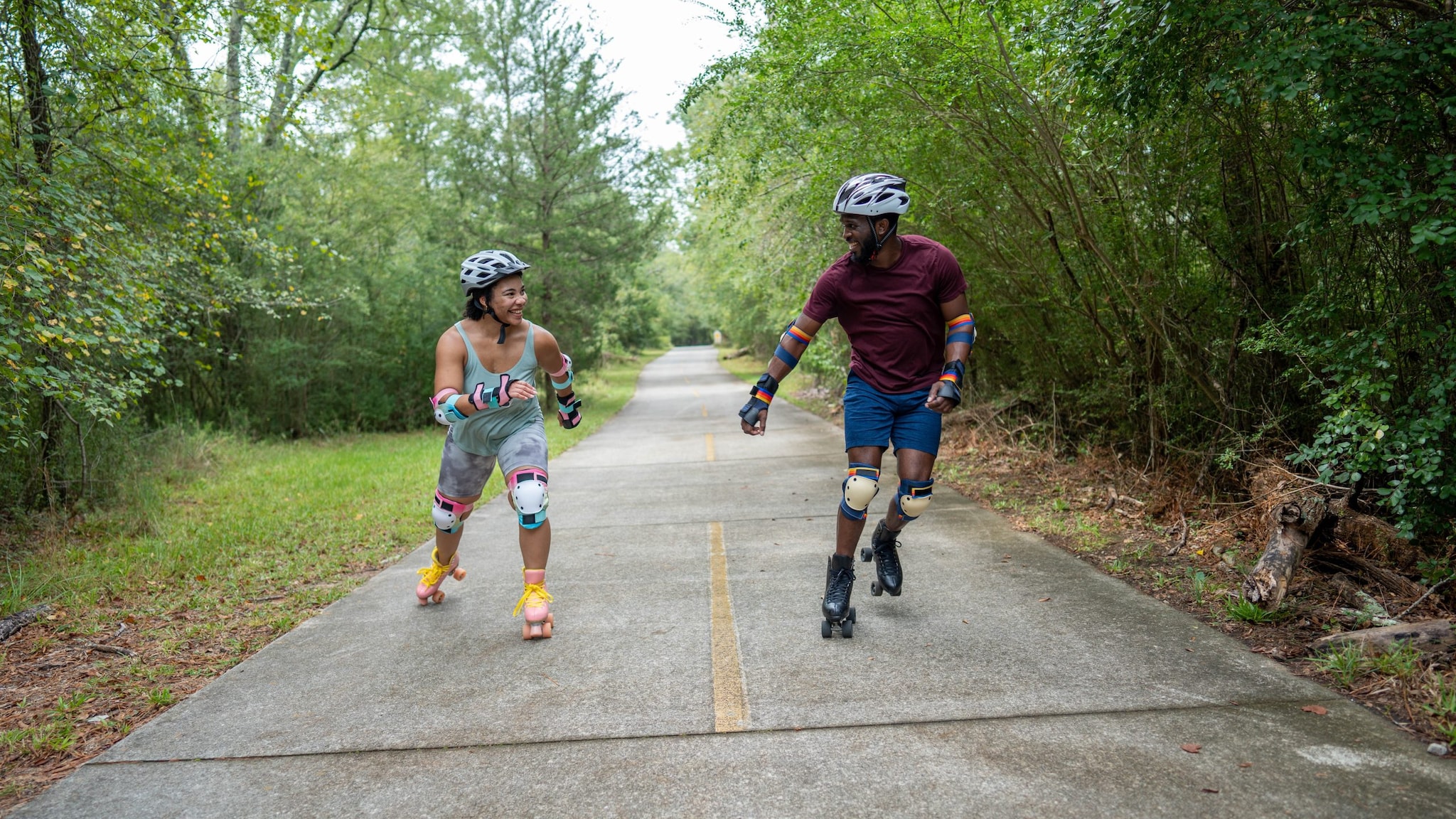 Two people roller skating.