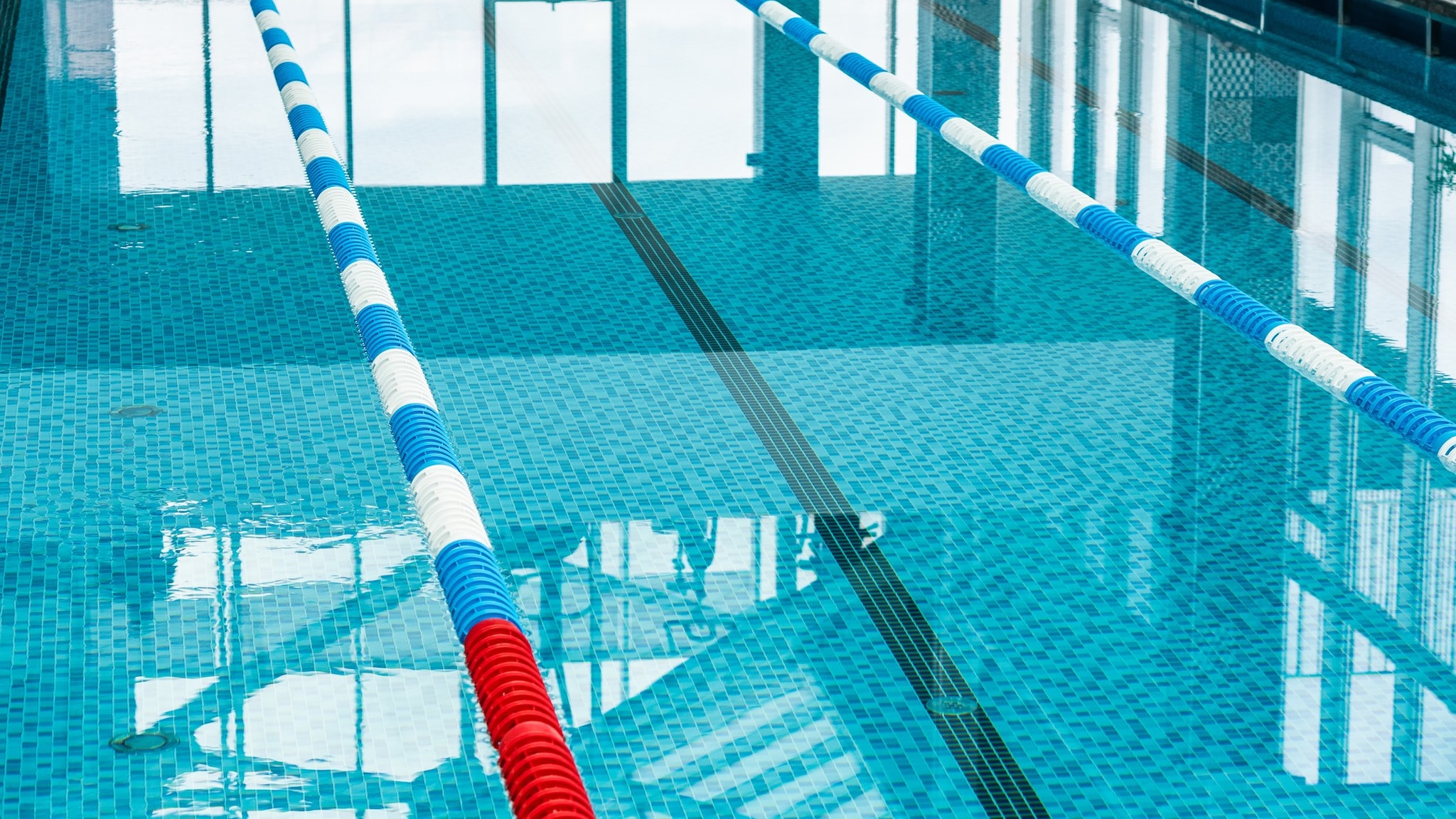 Close up of a pool lane at an indoor pool.