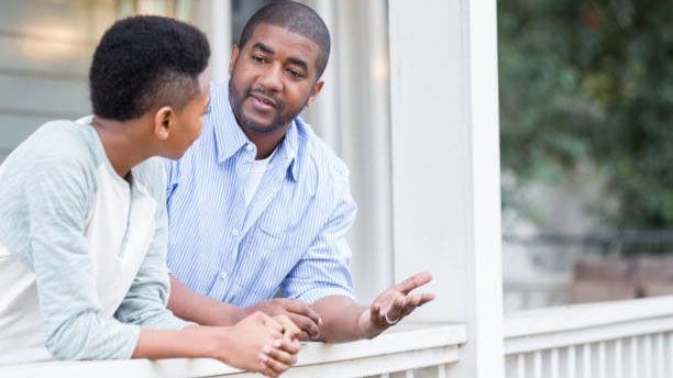 A father having conversation with son.