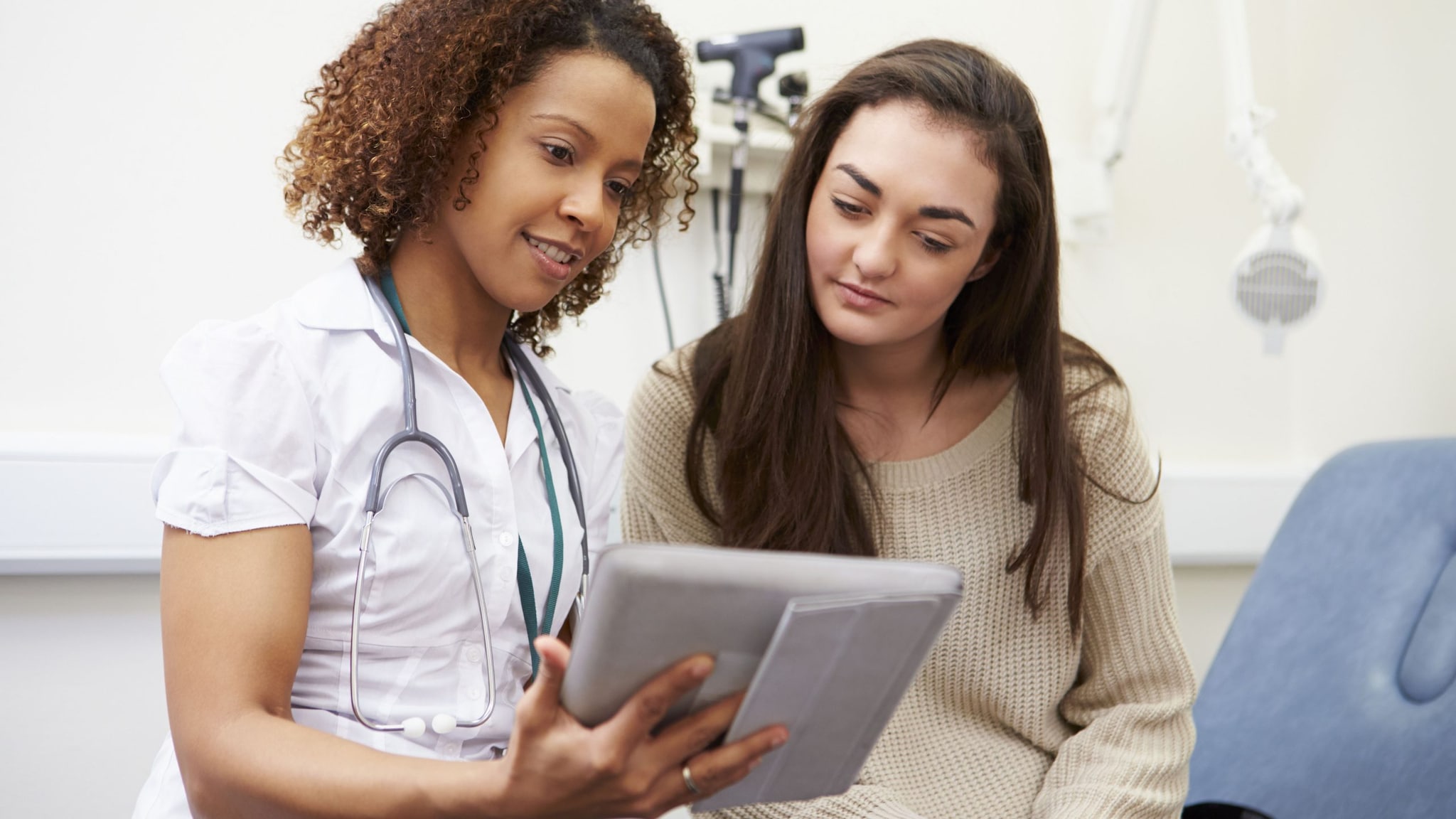 Female teen with a health care provider.