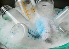sanitizing bottles in dishwasher