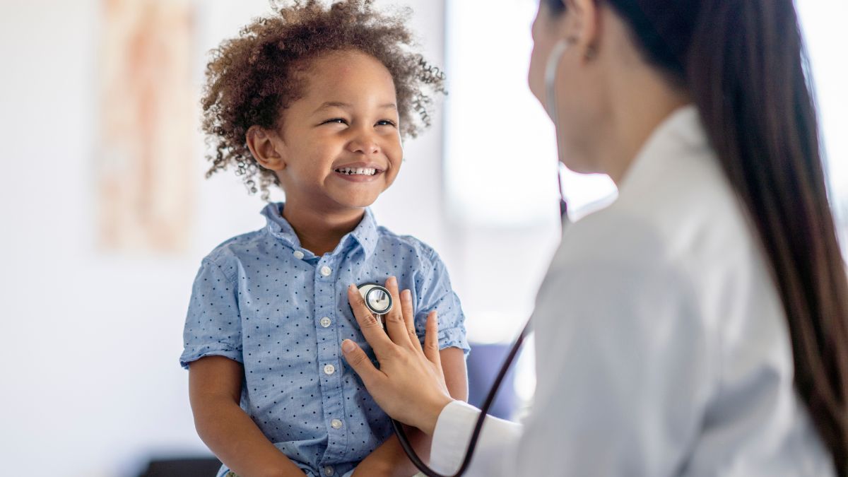 Doctor listening to toddler's heart