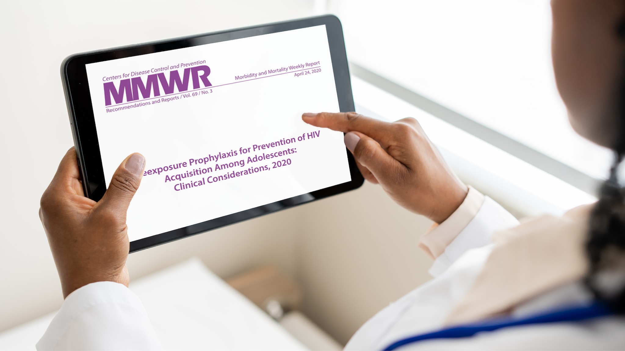 This image shows a female healthcare provider looking at a tablet displaying an HIV guideline document.