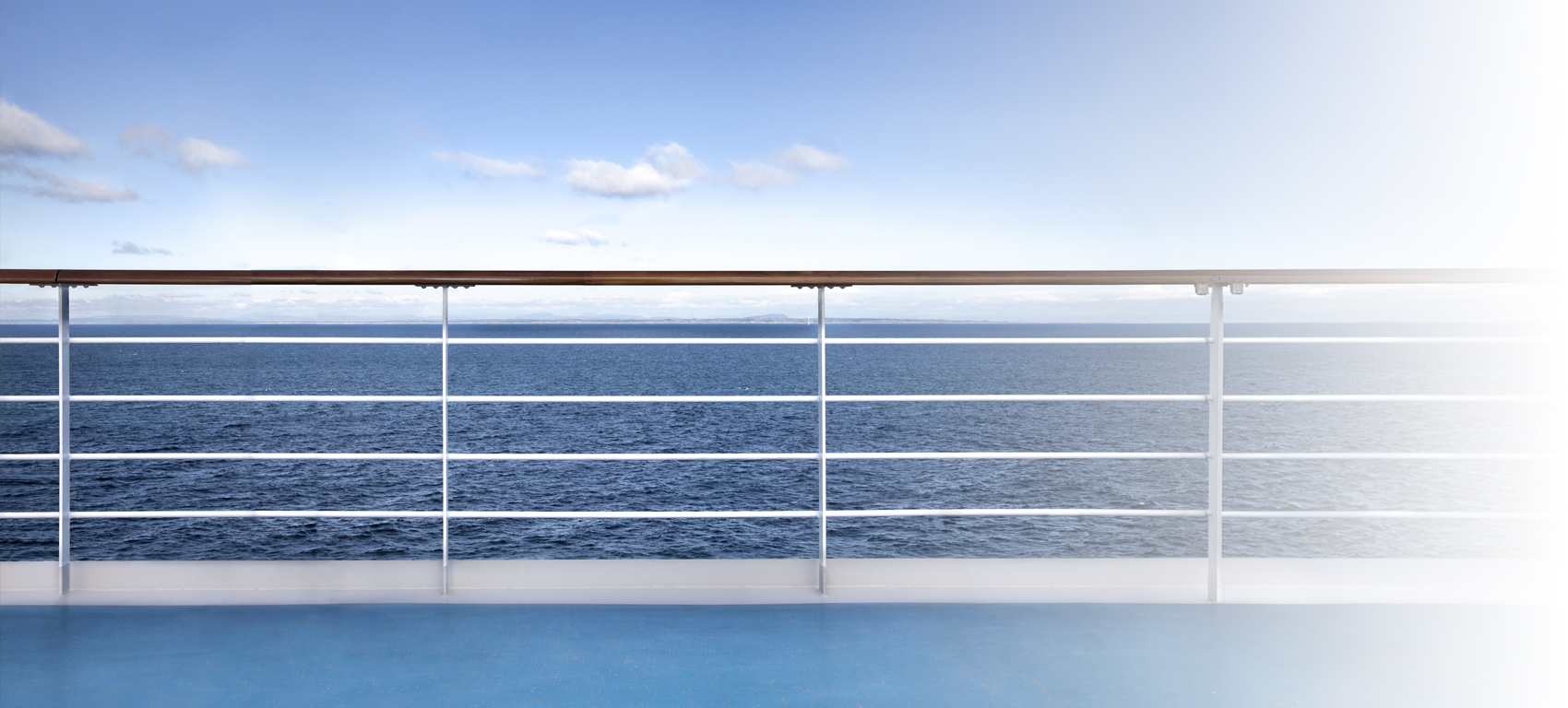 Cruise ship railing with the ocean as a background