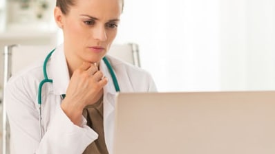 Doctor reading from a laptop