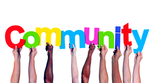 Various hands holding the alphabets making the word Community