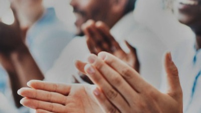 Group of people clapping in appreciation