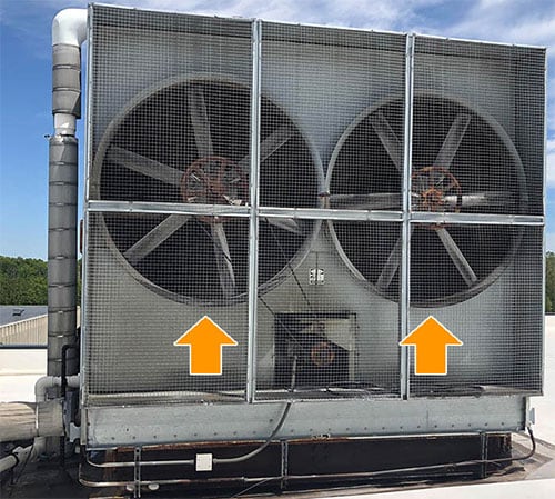 A cooling tower with side fans (highlighted with arrows), which are difficult to see from aerial photographs.