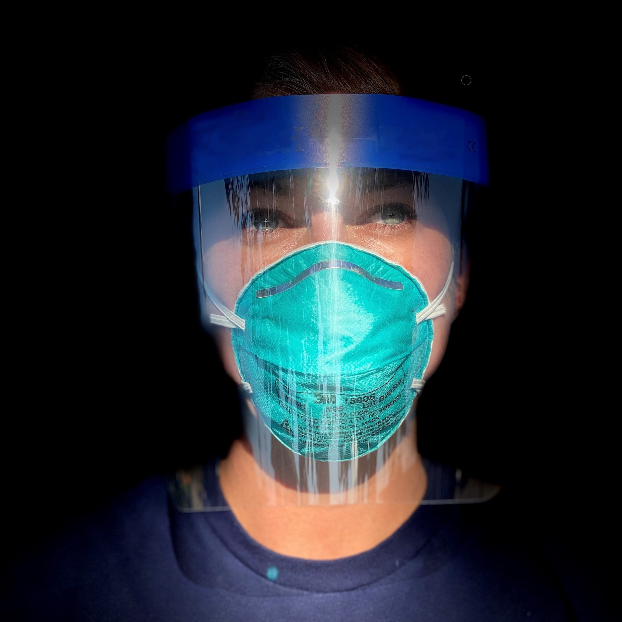 A laboratory scientist during CDC's COVID-19 response wearing a mask and face shield.