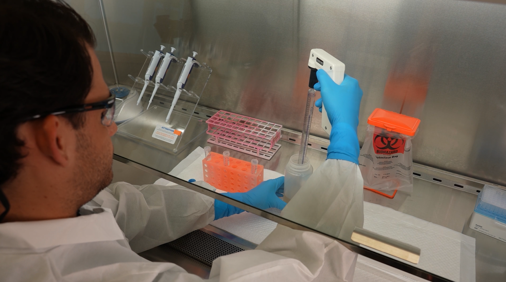 A lab scientist testing the sample of wastewater.