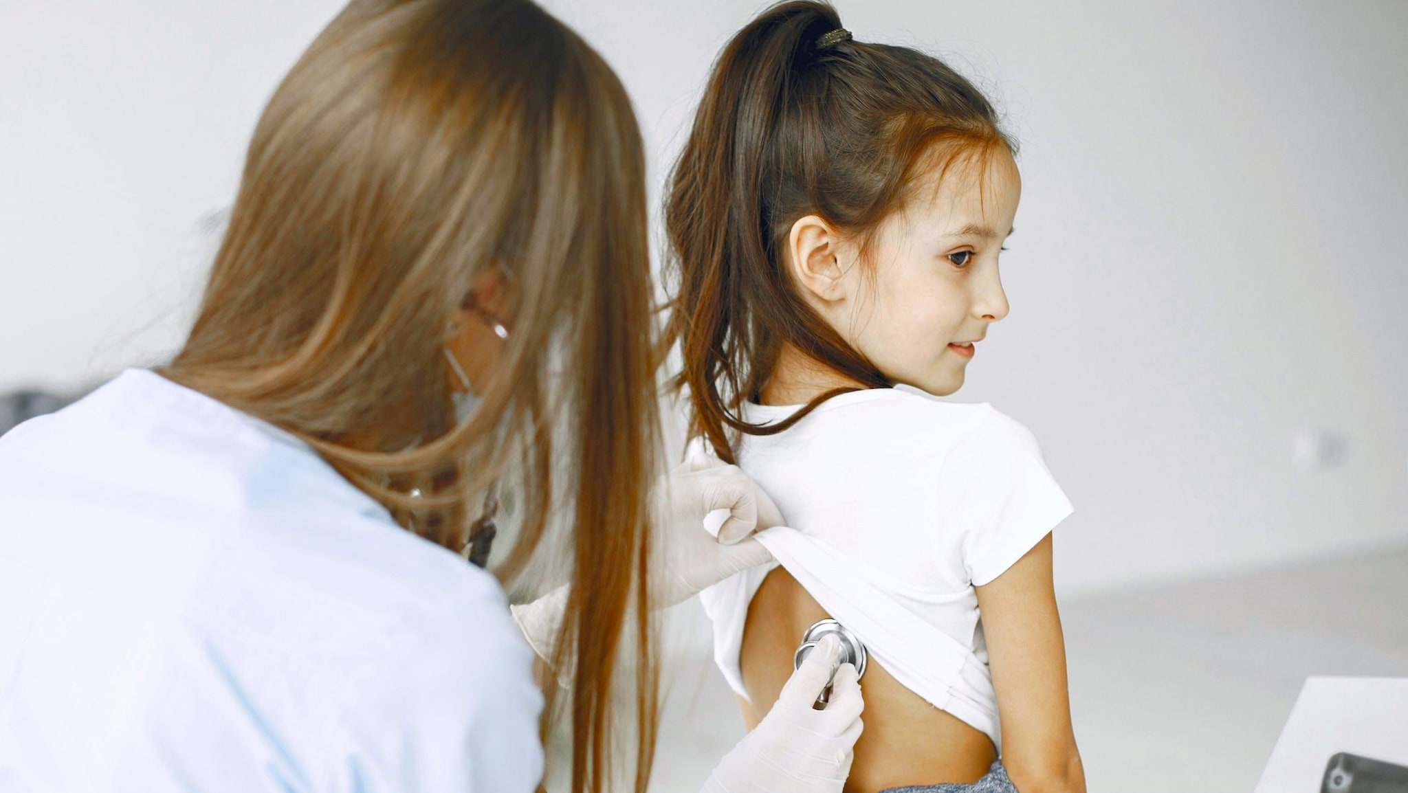 Doctor examining child.