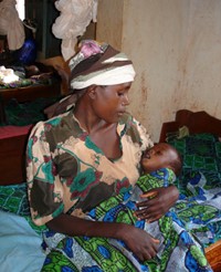 mother-sick-child Mother cradling sick child in her arms, Tanzania (Courtesy UNHCR Malaria Team).