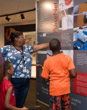 museum-day-2017-67_350px Adults and children viewing an exhibition