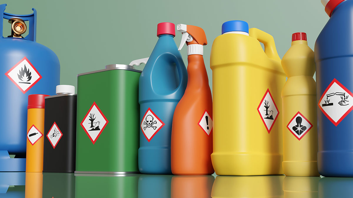 Multi-color chemical bottles with various warning labels on them.
