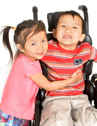 spinabifida-facts.jpg_ea59c Photo: Boy in wheelchair with girl