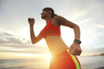 Image of woman exercising with smartwatch on wrist