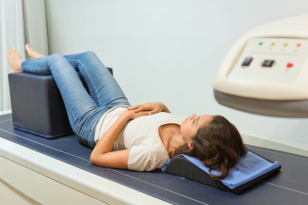 Woman laying down for a scan analysis