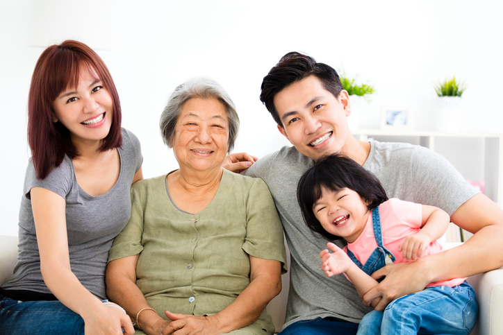 happy little girl with her grandmother and parent picture of family